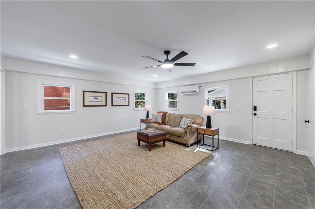 2996 Arrowood Drive East Point, GA 30344 - Photo 24 of 63 a living room with furniture and a ceiling fan
