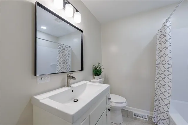 a bathroom with a tub and shower