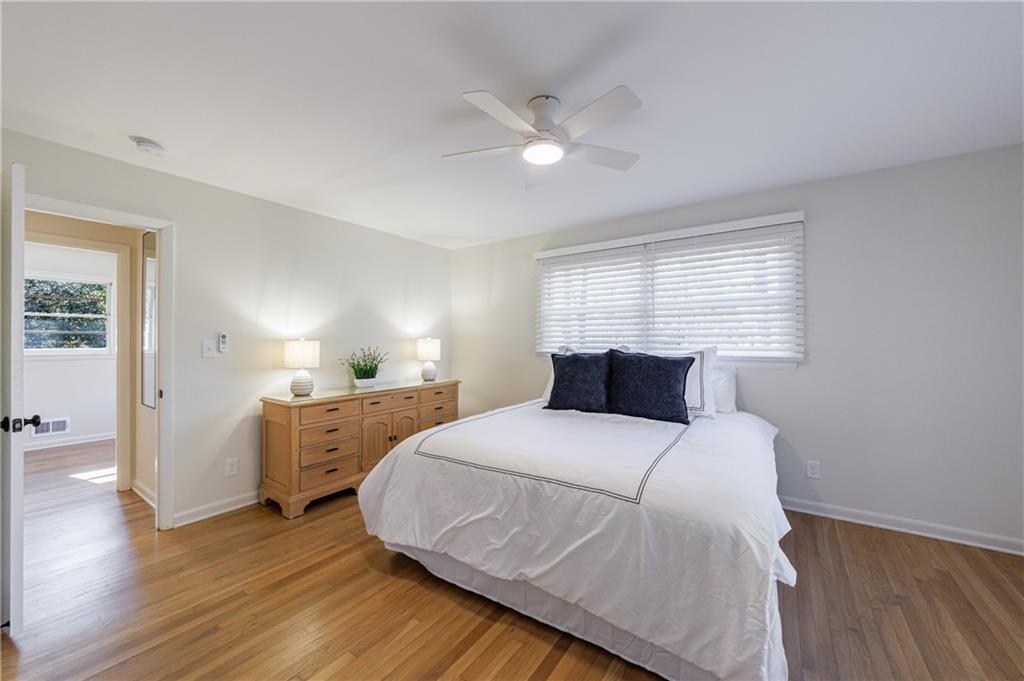 2996 Arrowood Drive East Point, GA 30344 - Photo 34 of 63 a bedroom with a bed and wooden floor