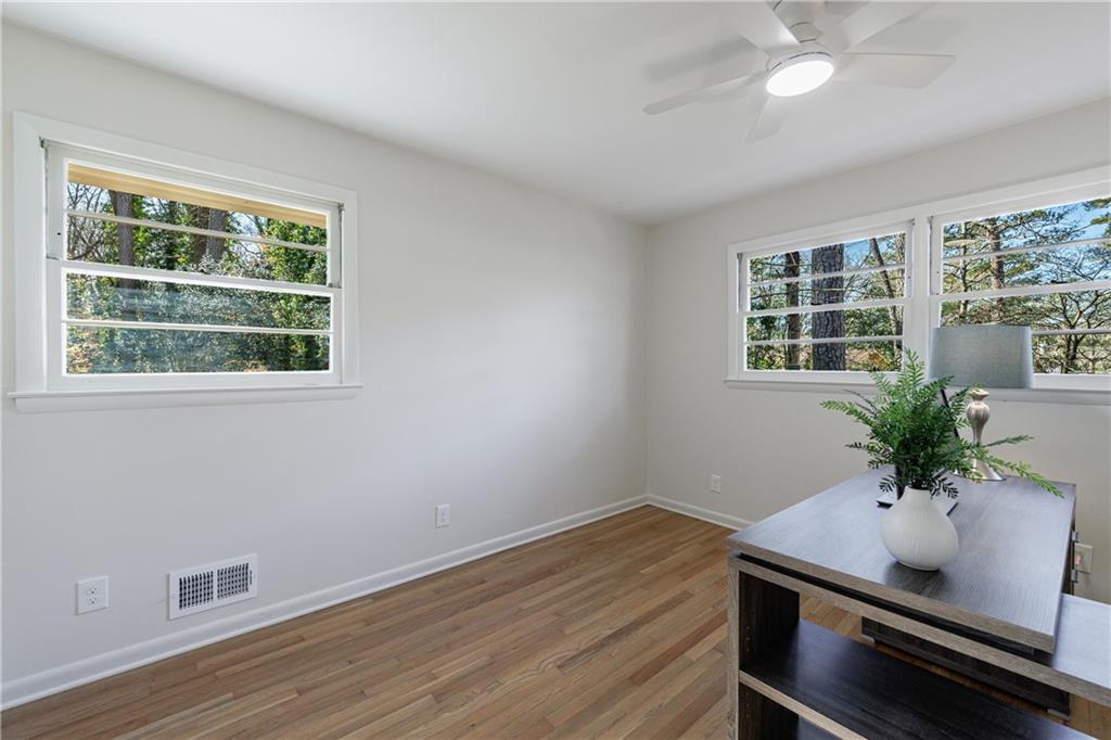 2996 Arrowood Drive East Point, GA 30344 - Photo 38 of 63 a room with wooden floor and windows