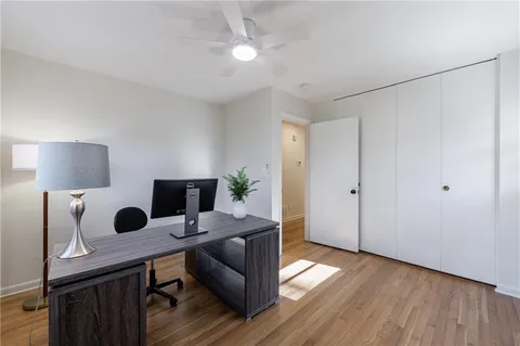 a view of a house with swimming pool and sitting area
