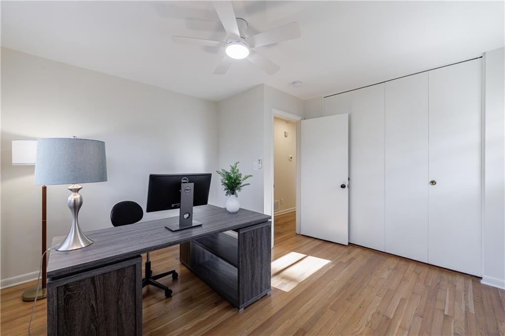2996 Arrowood Drive East Point, GA 30344 - Photo 40 of 63 a view of a workspace with furniture and wooden floor