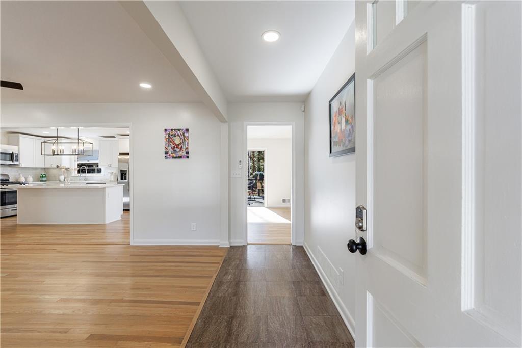 2996 Arrowood Drive East Point, GA 30344 - Photo 4 of 63 a view of a kitchen with wooden floor and a refrigerator