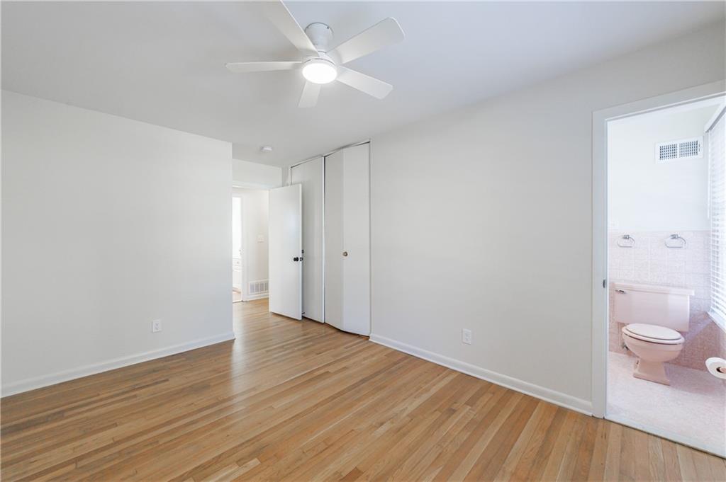 2996 Arrowood Drive East Point, GA 30344 - Photo 42 of 63 wooden floor in an empty room with a bathroom