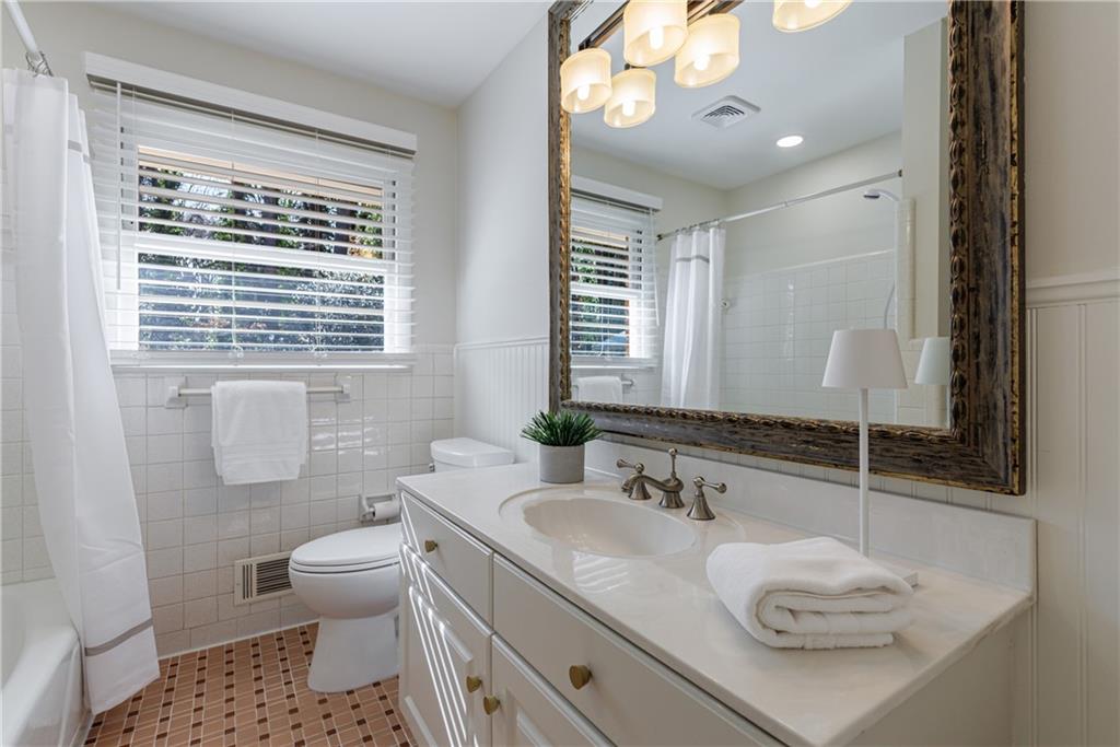 2996 Arrowood Drive East Point, GA 30344 - Photo 43 of 63 a bathroom with a granite countertop sink mirror vanity and toilet