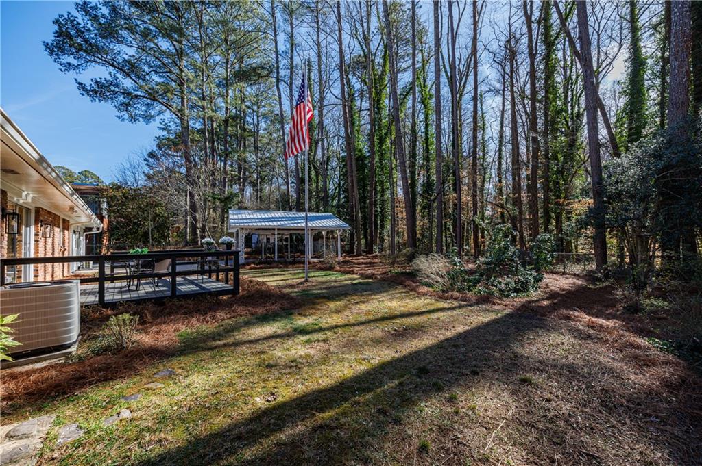 2996 Arrowood Drive East Point, GA 30344 - Photo 46 of 63 a view of a house with swimming pool and sitting area
