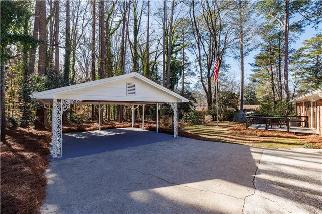 a sign board with a park bench