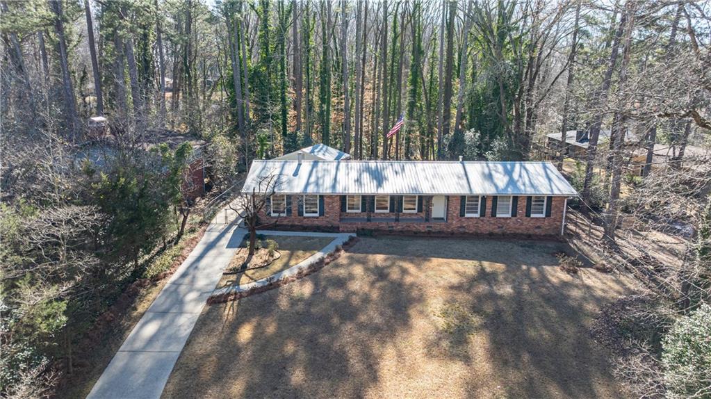 2996 Arrowood Drive East Point, GA 30344 - Photo 54 of 63 a view of a roof deck with wooden fence and trees