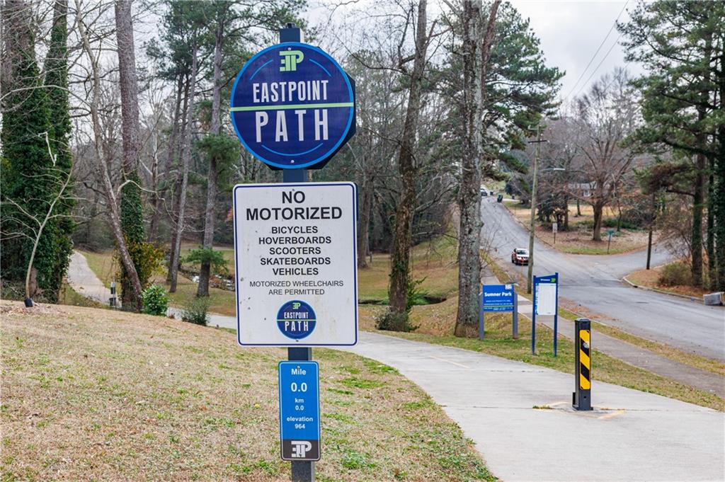 2996 Arrowood Drive East Point, GA 30344 - Photo 58 of 63 a sign board with a park bench