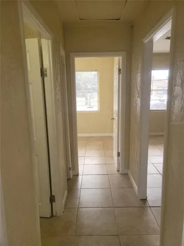 a bathroom with a glass door shower and a sink