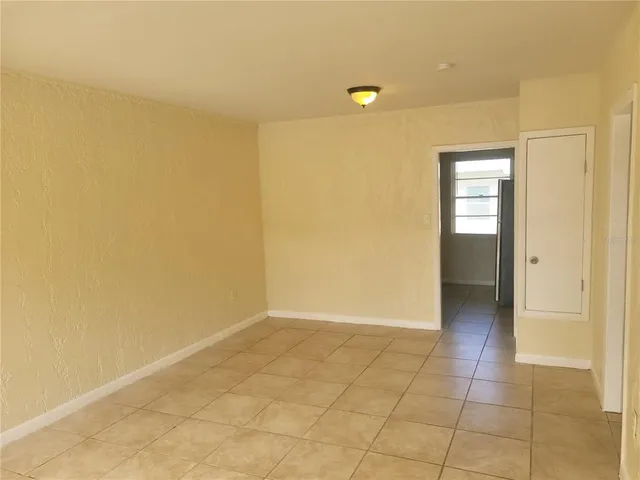 a view of an empty room and window