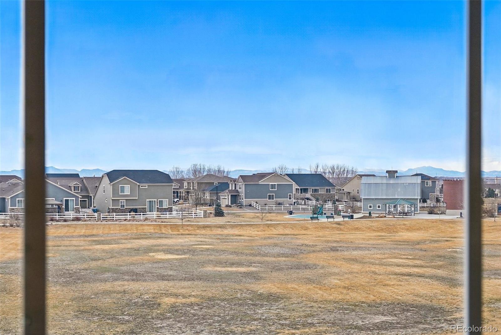 745 Penstemon Drive Henderson, CO 80640 - Photo 14 of 38 a view of a city with an ocean view