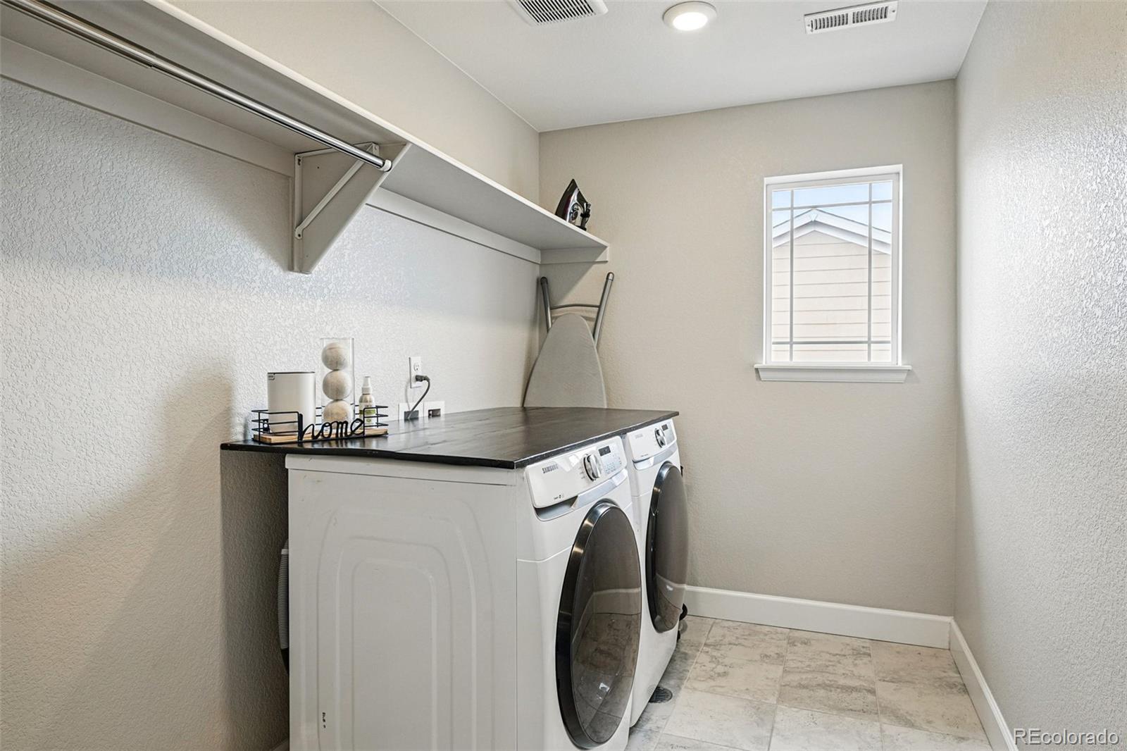 745 Penstemon Drive Henderson, CO 80640 - Photo 23 of 38 a utility room with dryer and washer