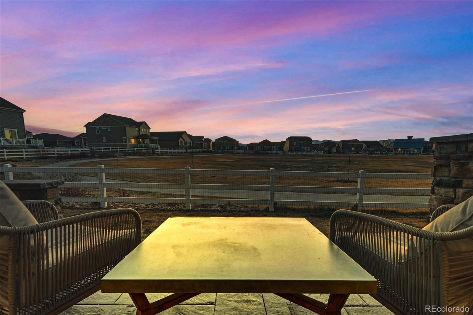 745 Penstemon Drive Henderson, CO 80640 - Photo 26 of 38 a view of a tennis net on a tennis court