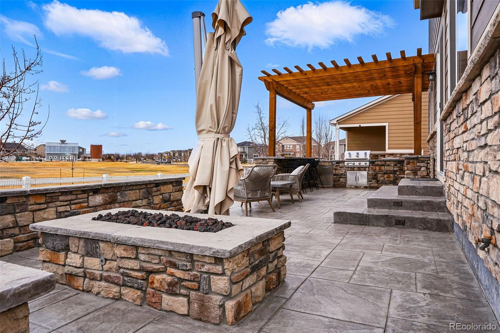 745 Penstemon Drive Henderson, CO 80640 - Photo 27 of 38 a view of a chairs and table in the patio