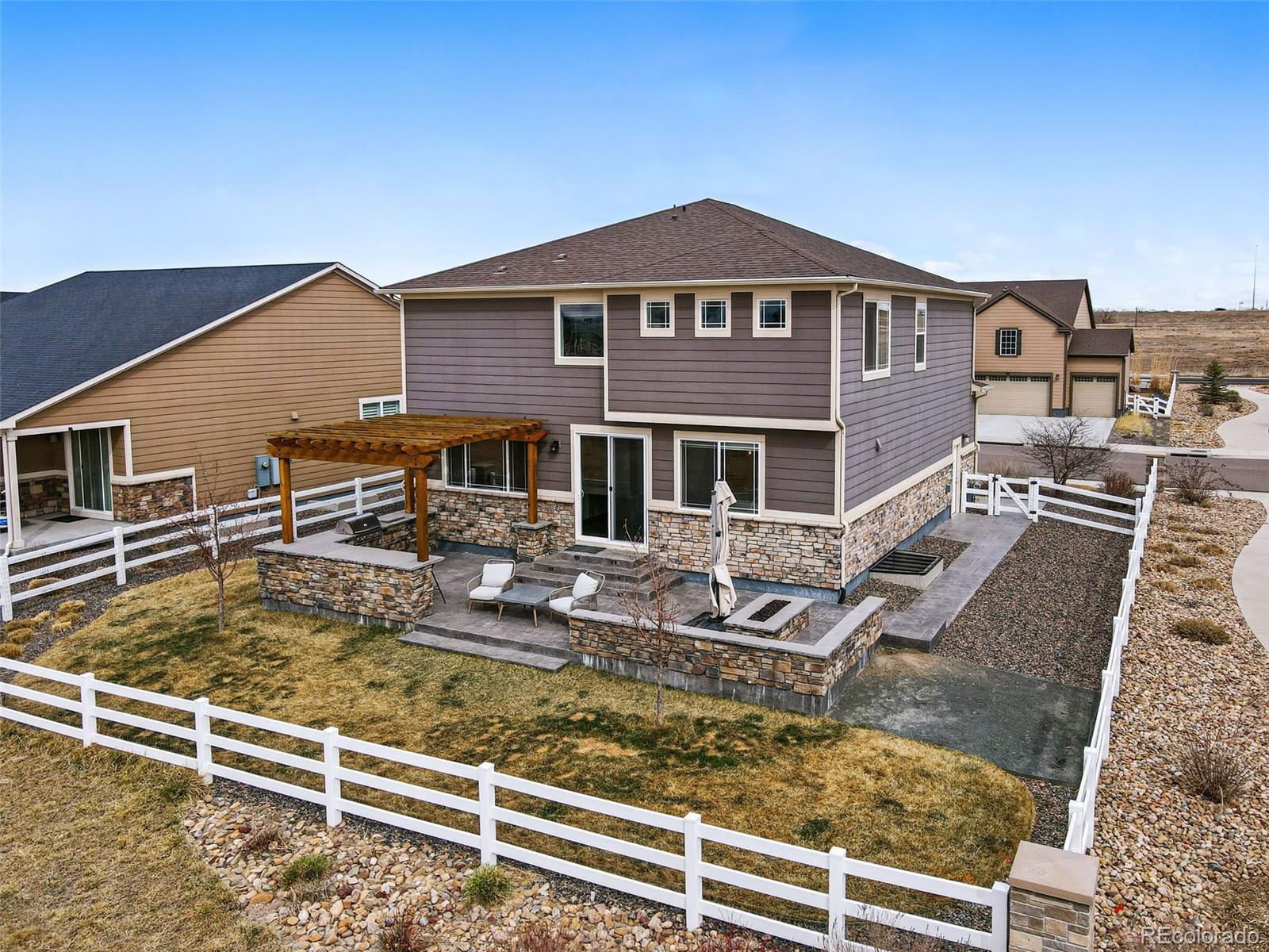 745 Penstemon Drive Henderson, CO 80640 - Photo 31 of 38 a front view of a house with entertaining space