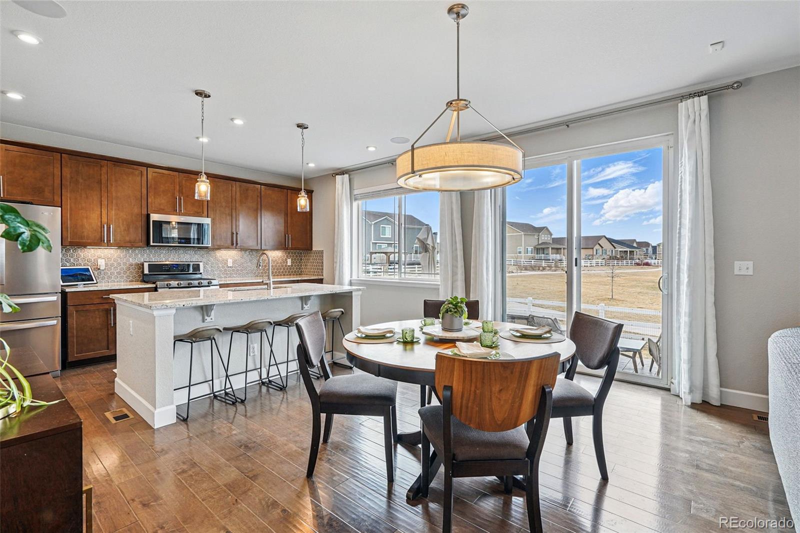 745 Penstemon Drive Henderson, CO 80640 - Photo 7 of 38 a view of a dining room with furniture window and outside view