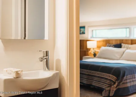 a bathroom with a bathtub and a sink