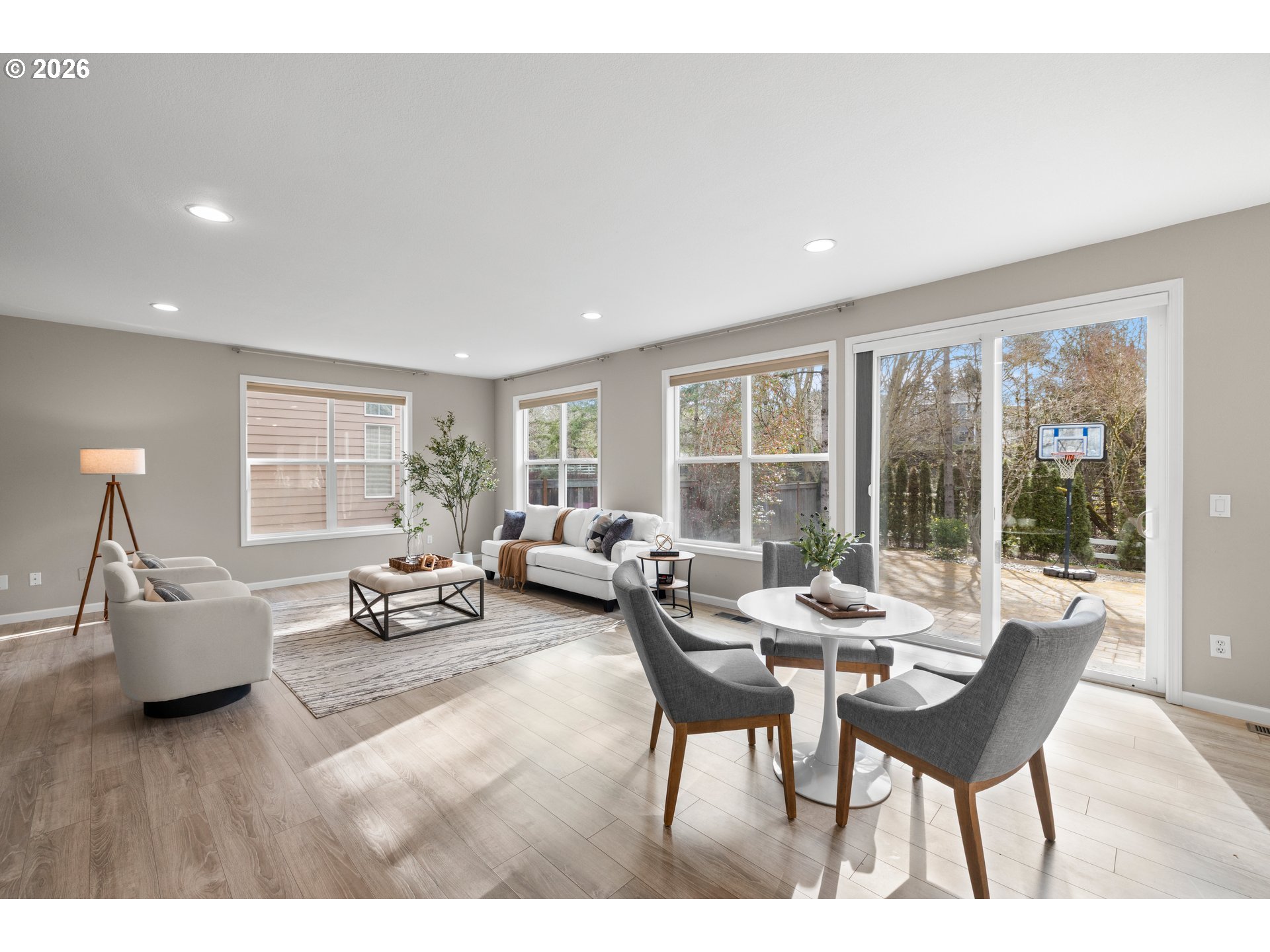 15542 Northwest Andalusian Way Portland, OR 97229 - Photo 13 of 48 a living room with furniture and large windows