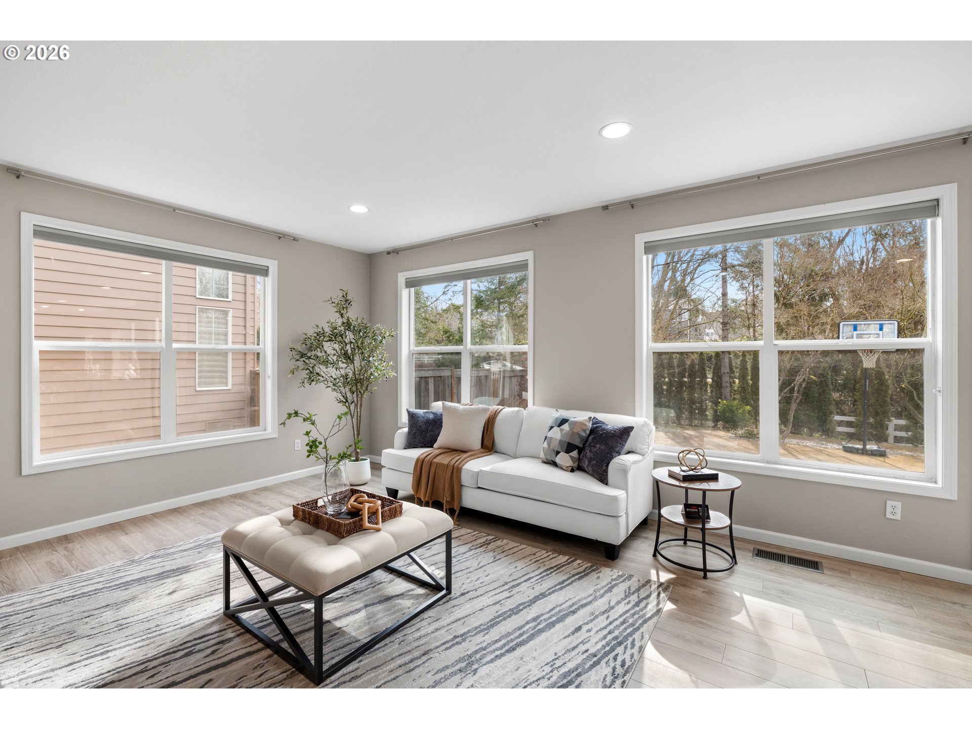15542 Northwest Andalusian Way Portland, OR 97229 - Photo 17 of 48 a living room with furniture and a large window