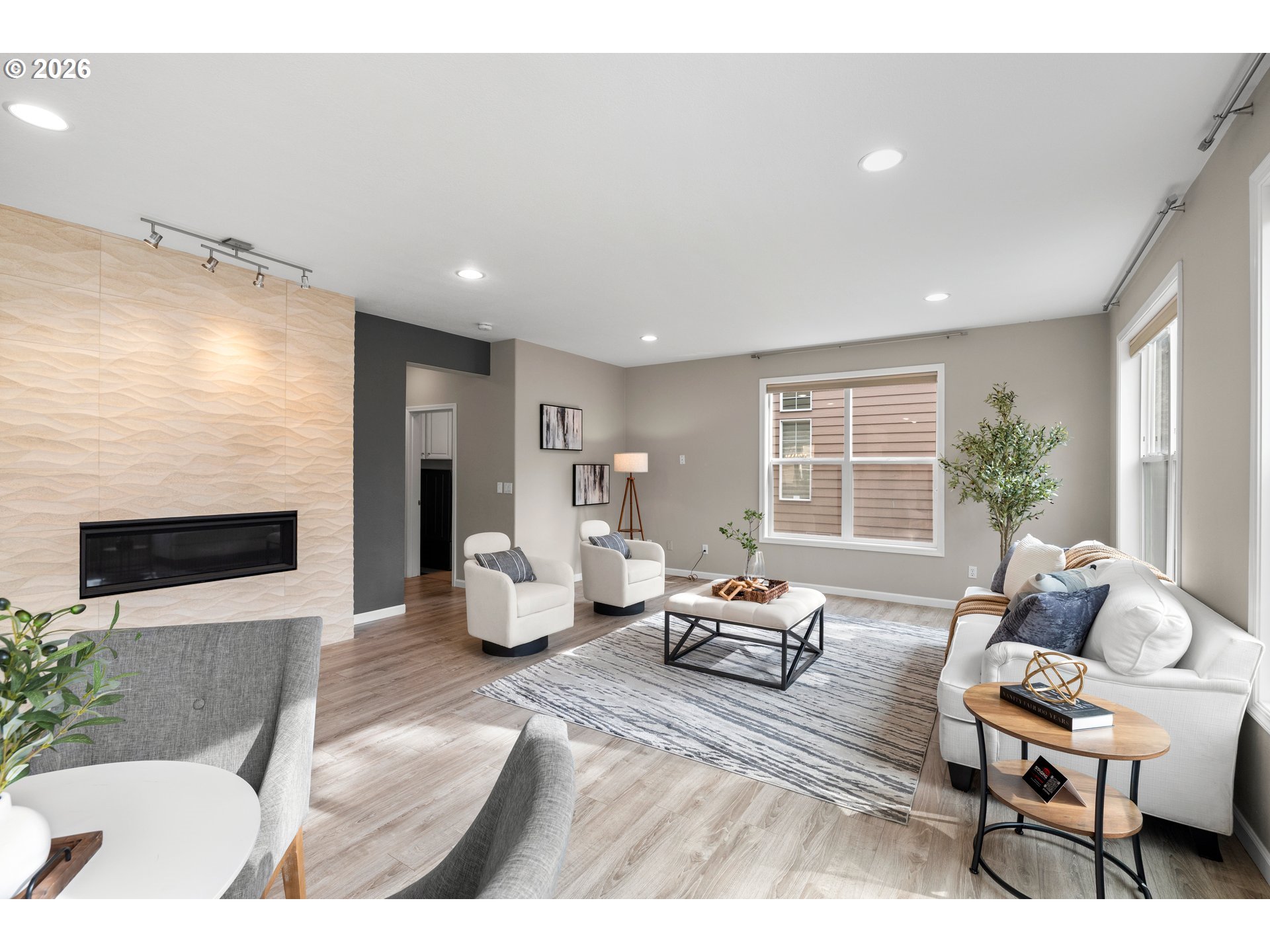 15542 Northwest Andalusian Way Portland, OR 97229 - Photo 18 of 48 a living room with furniture and a fireplace