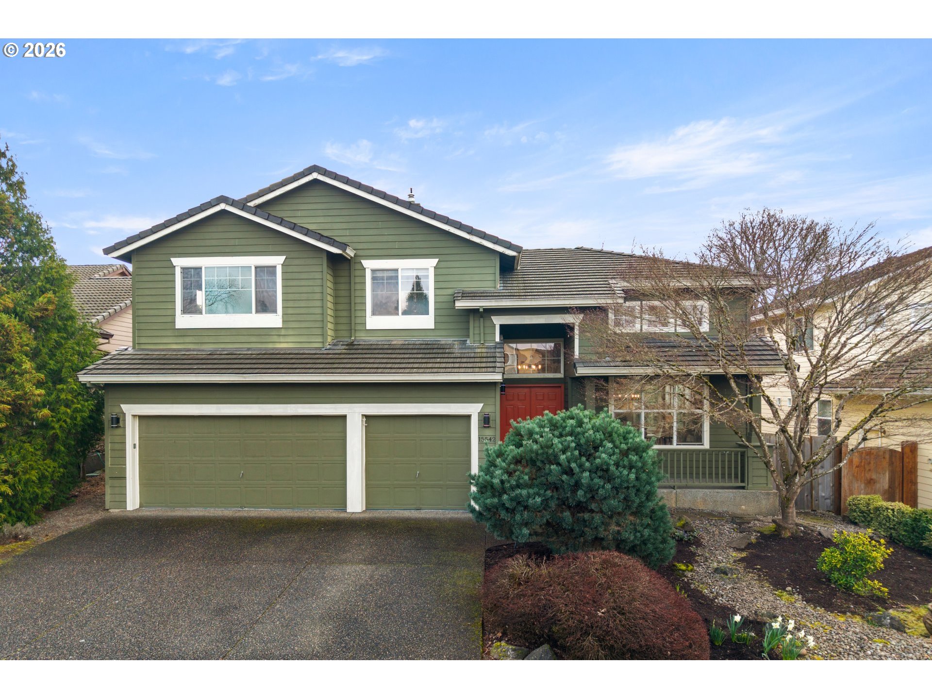 15542 Northwest Andalusian Way Portland, OR 97229 - Photo 2 of 48 a front view of a house with a garage and balcony