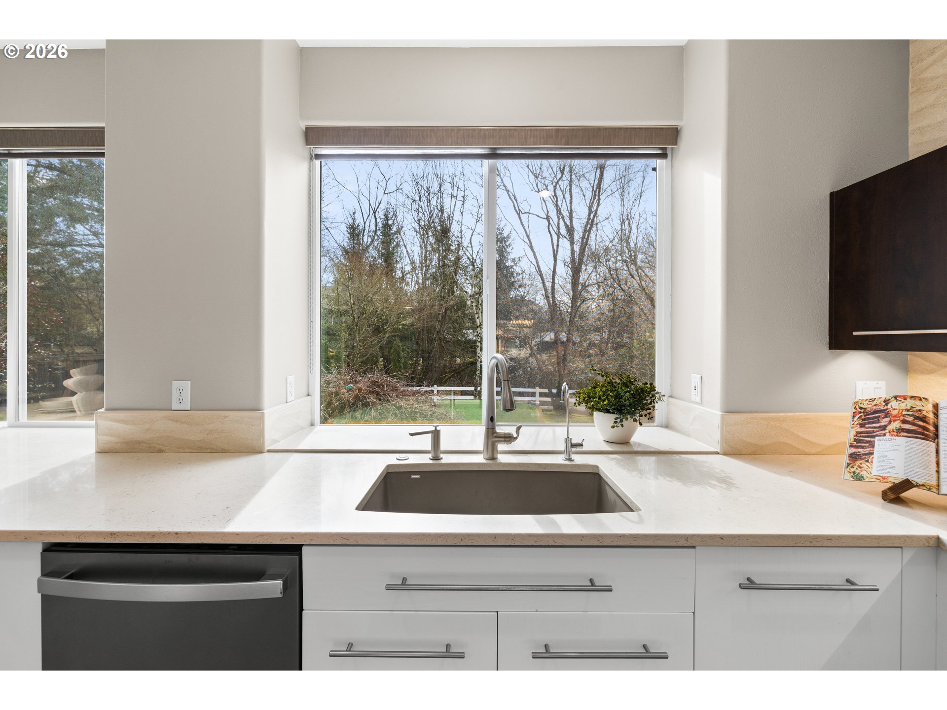 15542 Northwest Andalusian Way Portland, OR 97229 - Photo 24 of 48 a sink and a television in a kitchen