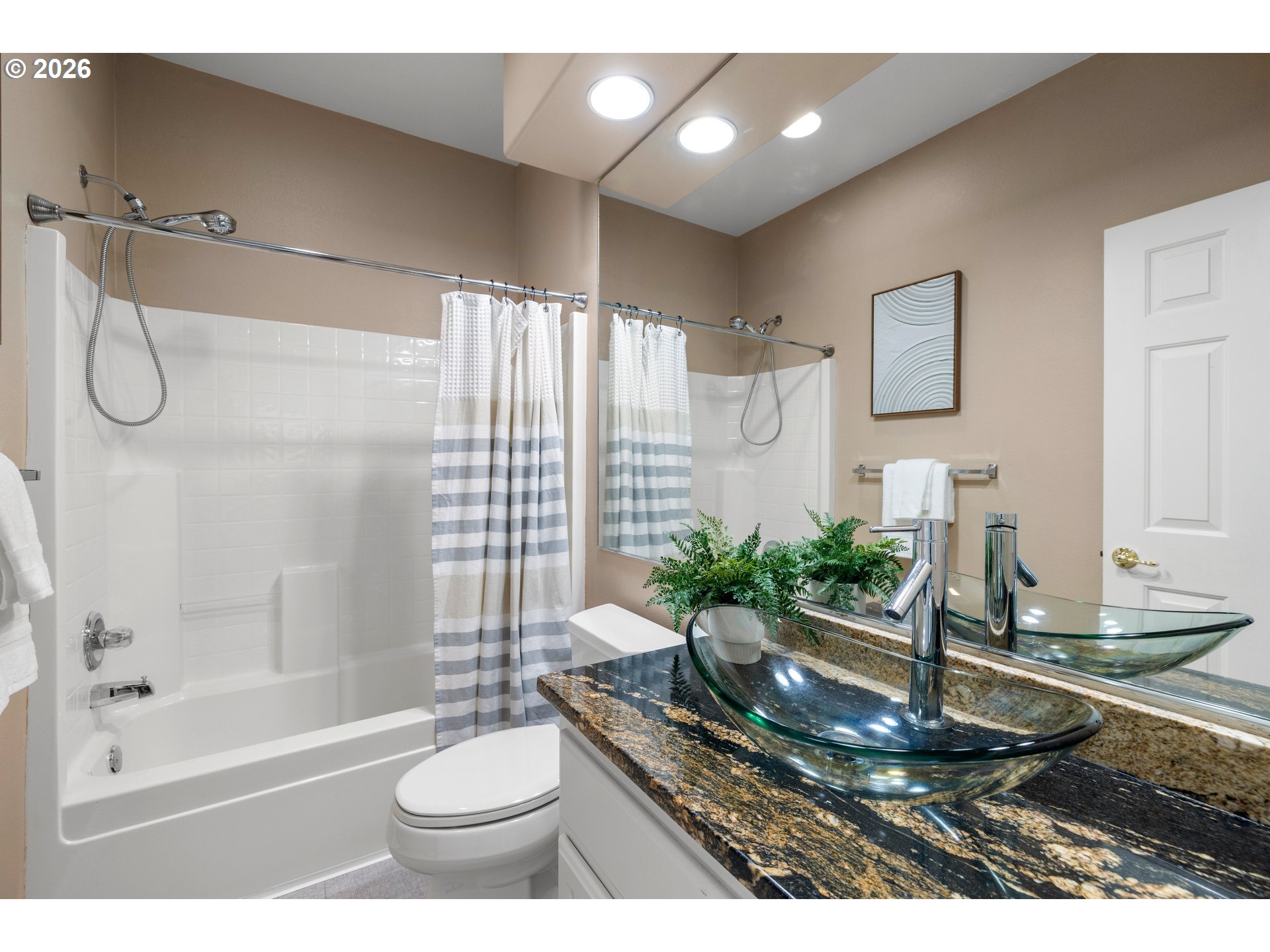 15542 Northwest Andalusian Way Portland, OR 97229 - Photo 26 of 48 a bathroom with a granite countertop sink a toilet a mirror and bathtub