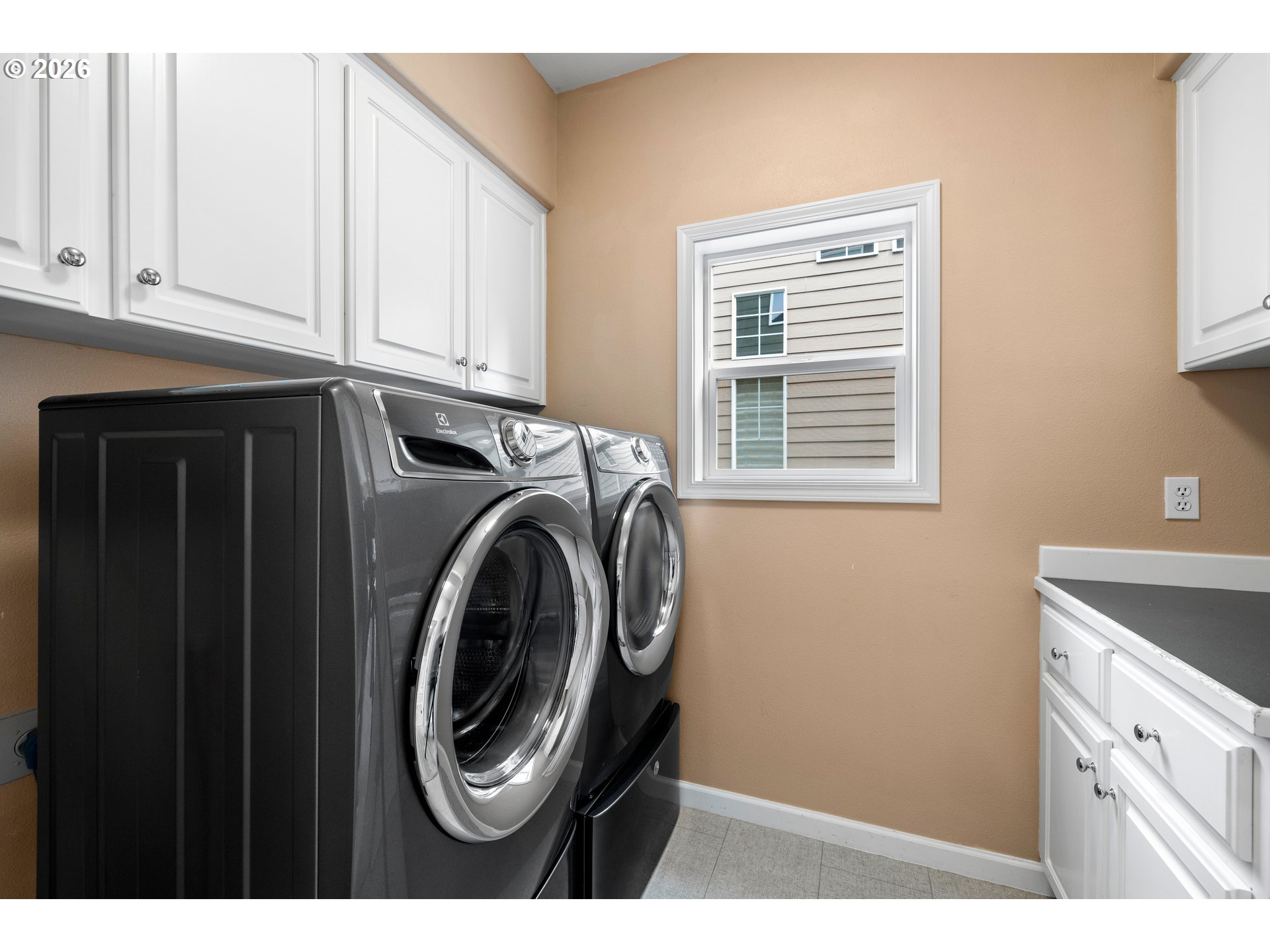 15542 Northwest Andalusian Way Portland, OR 97229 - Photo 27 of 48 a utility room with dryer and washer