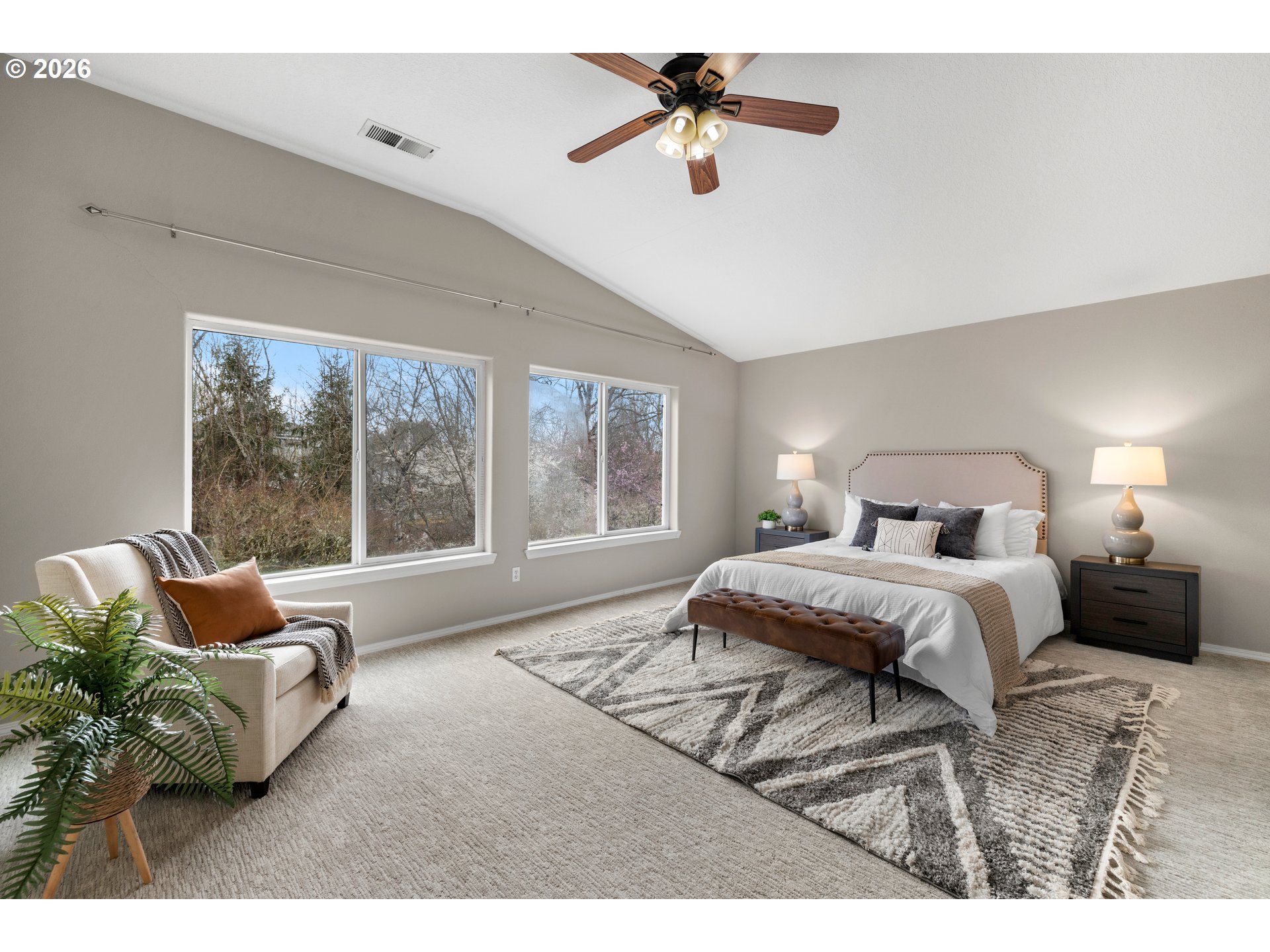 15542 Northwest Andalusian Way Portland, OR 97229 - Photo 28 of 48 a bedroom with a bed and glass window