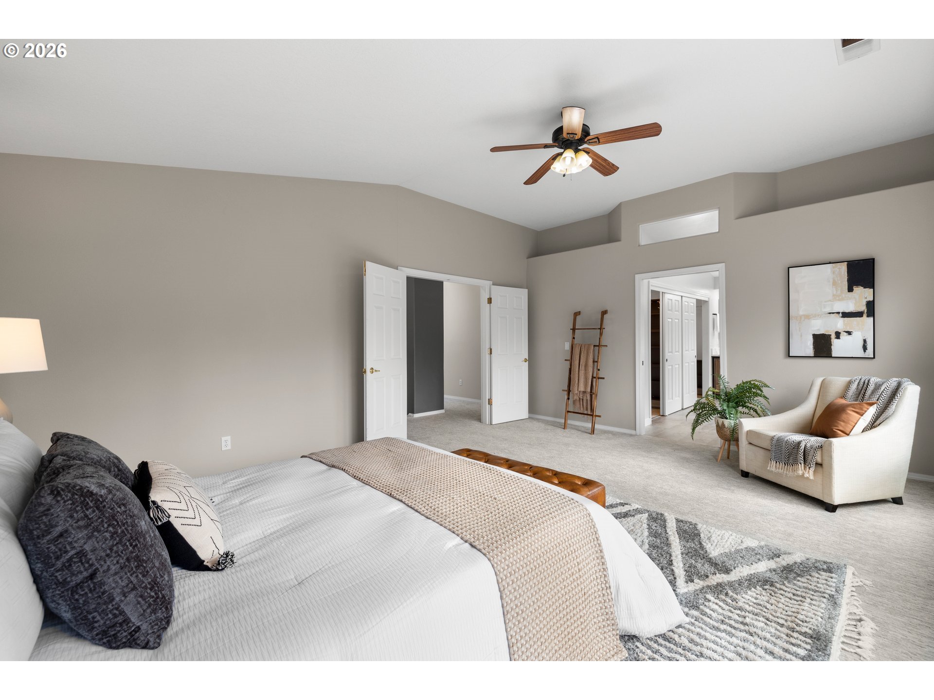 15542 Northwest Andalusian Way Portland, OR 97229 - Photo 30 of 48 a bedroom with a large bed and ceiling fan