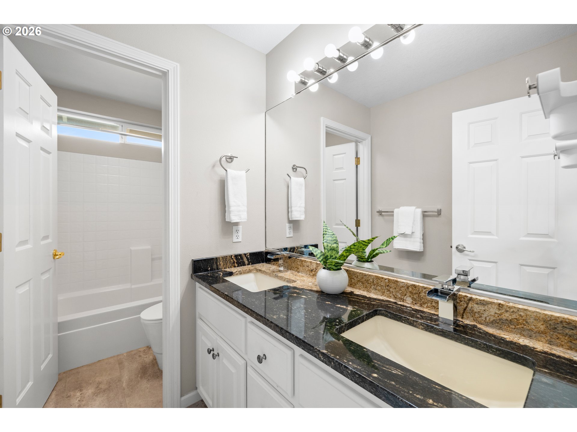 15542 Northwest Andalusian Way Portland, OR 97229 - Photo 37 of 48 a bathroom with a sink double vanity granite tub and a mirror