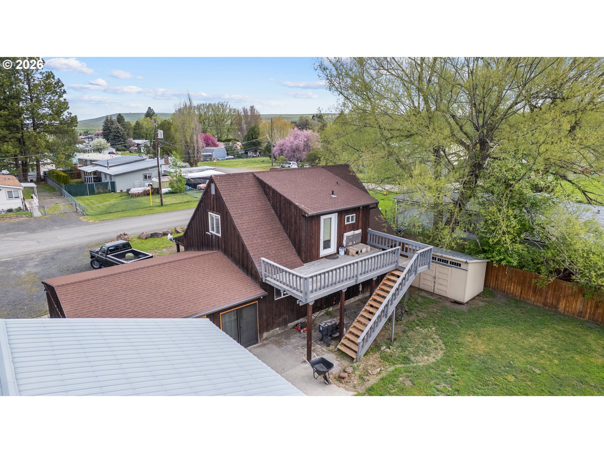 604 Mildred Street Enterprise, OR 97828 - Photo 29 of 37 a aerial view of a house with garden space and street view