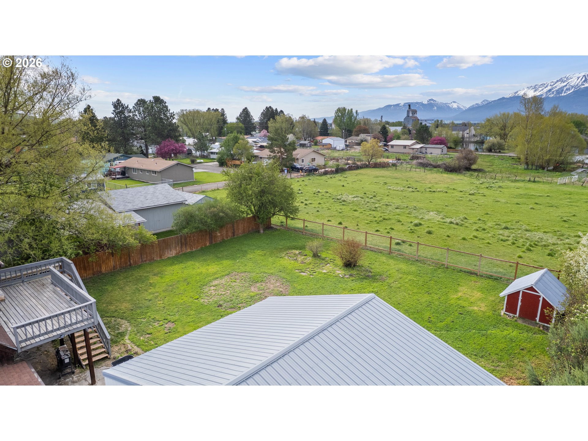 604 Mildred Street Enterprise, OR 97828 - Photo 30 of 37 a backyard of a house with a yard and mountain view in back
