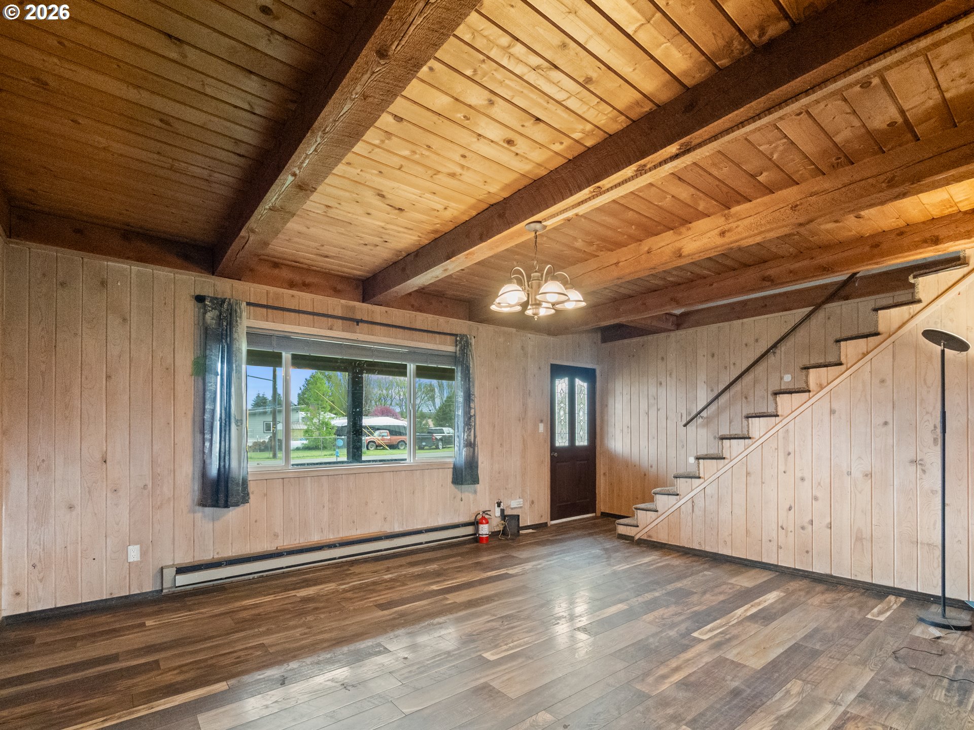 604 Mildred Street Enterprise, OR 97828 - Photo 3 of 37 a view of an empty room with wooden floor and a window