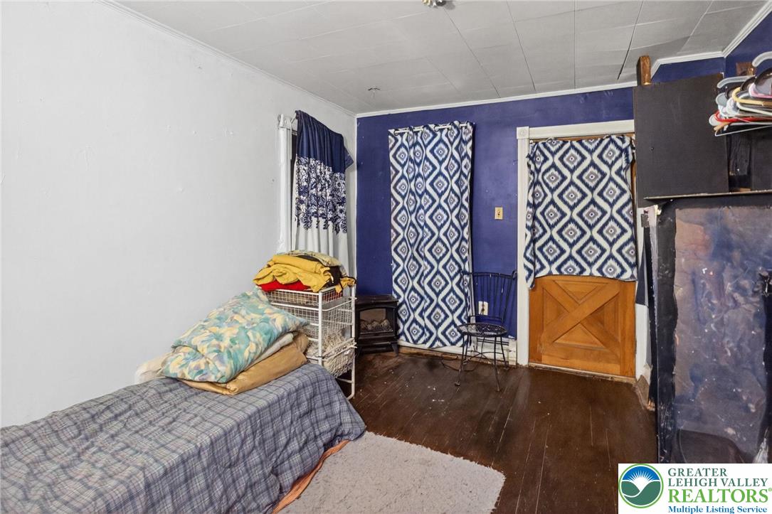 19 East Patterson Street Lansford, PA 18232 - Photo 14 of 17 a bedroom with a bed and dresser