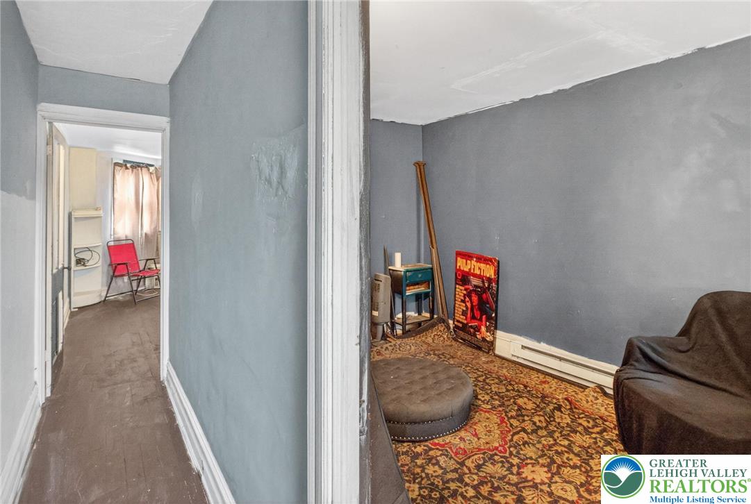 19 East Patterson Street Lansford, PA 18232 - Photo 9 of 17 a view of a hallway to a livingroom with furniture