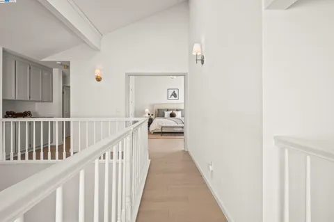 a view of a hallway view with staircase