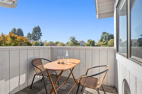 a table and chairs in front of a door