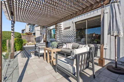 a patio with table and chairs