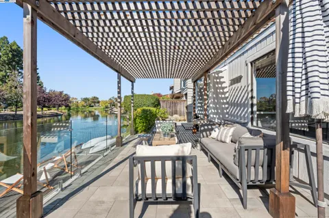 a view of a chairs and tables in the balcony
