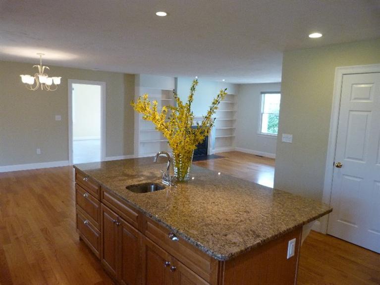 1399 Halls Path Harwich, MA 02645 - Photo 13 of 34 a kitchen with a sink a counter space and a wooden floor