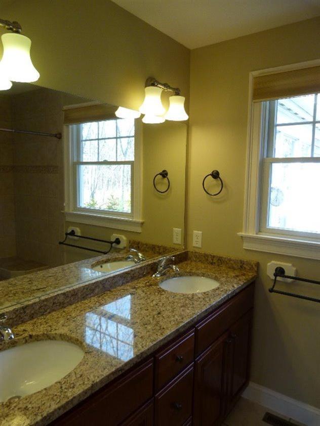 1399 Halls Path Harwich, MA 02645 - Photo 24 of 34 a bathroom with a granite countertop sink and a mirror