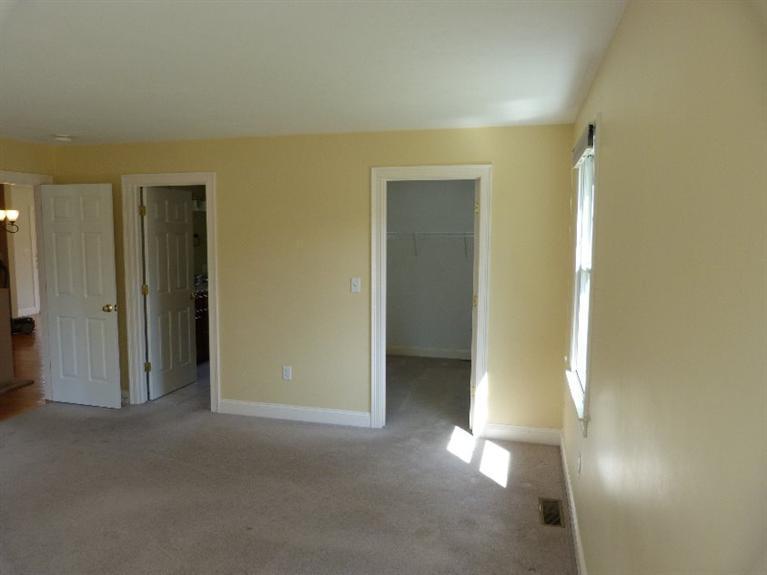 1399 Halls Path Harwich, MA 02645 - Photo 26 of 34 an empty room with closet and a bathroom
