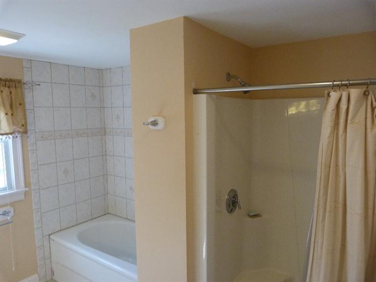 1399 Halls Path Harwich, MA 02645 - Photo 27 of 34 a bathroom with a shower and a bath tub