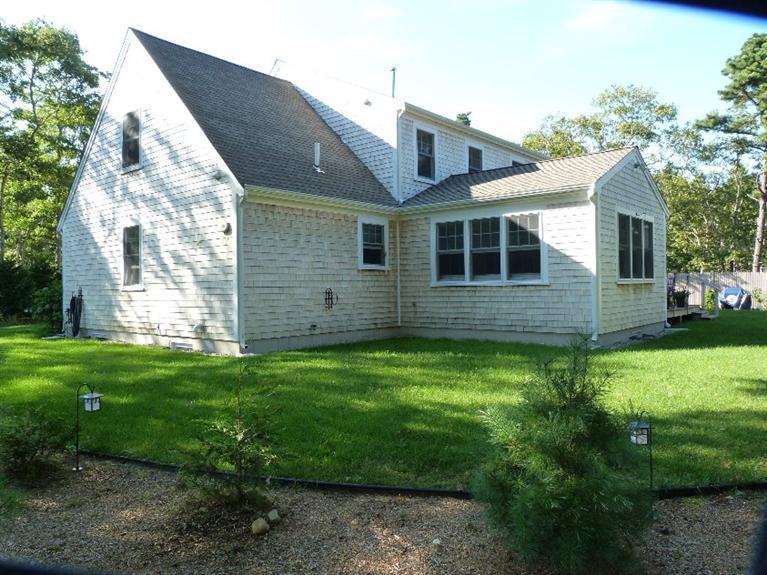 1399 Halls Path Harwich, MA 02645 - Photo 3 of 34 a view of a house with a backyard