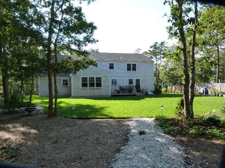 1399 Halls Path Harwich, MA 02645 - Photo 4 of 34 a view of a house with a backyard