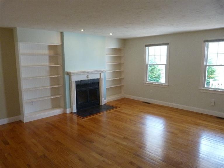 1399 Halls Path Harwich, MA 02645 - Photo 6 of 34 a view of an empty room with a window and wooden floor