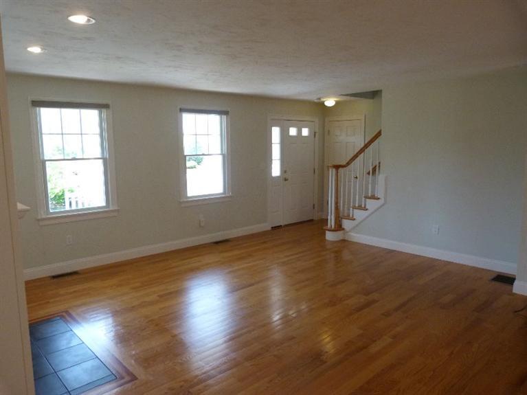 1399 Halls Path Harwich, MA 02645 - Photo 7 of 34 an empty room with wooden floor and windows