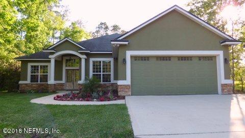 1576 Scott Road Fruit Cove, FL 32259 - Photo 2 of 87 a front view of a house with yard and green space